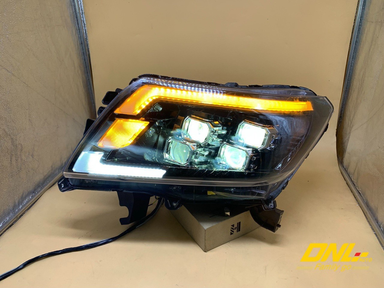 đèn pha nissan navara - Hình 2