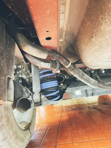 Nâng Lo Xo Giảm Xóc Xe Mazda: Tìm Hiểu Chuyên Sâu & Hướng Dẫn Chi Tiết